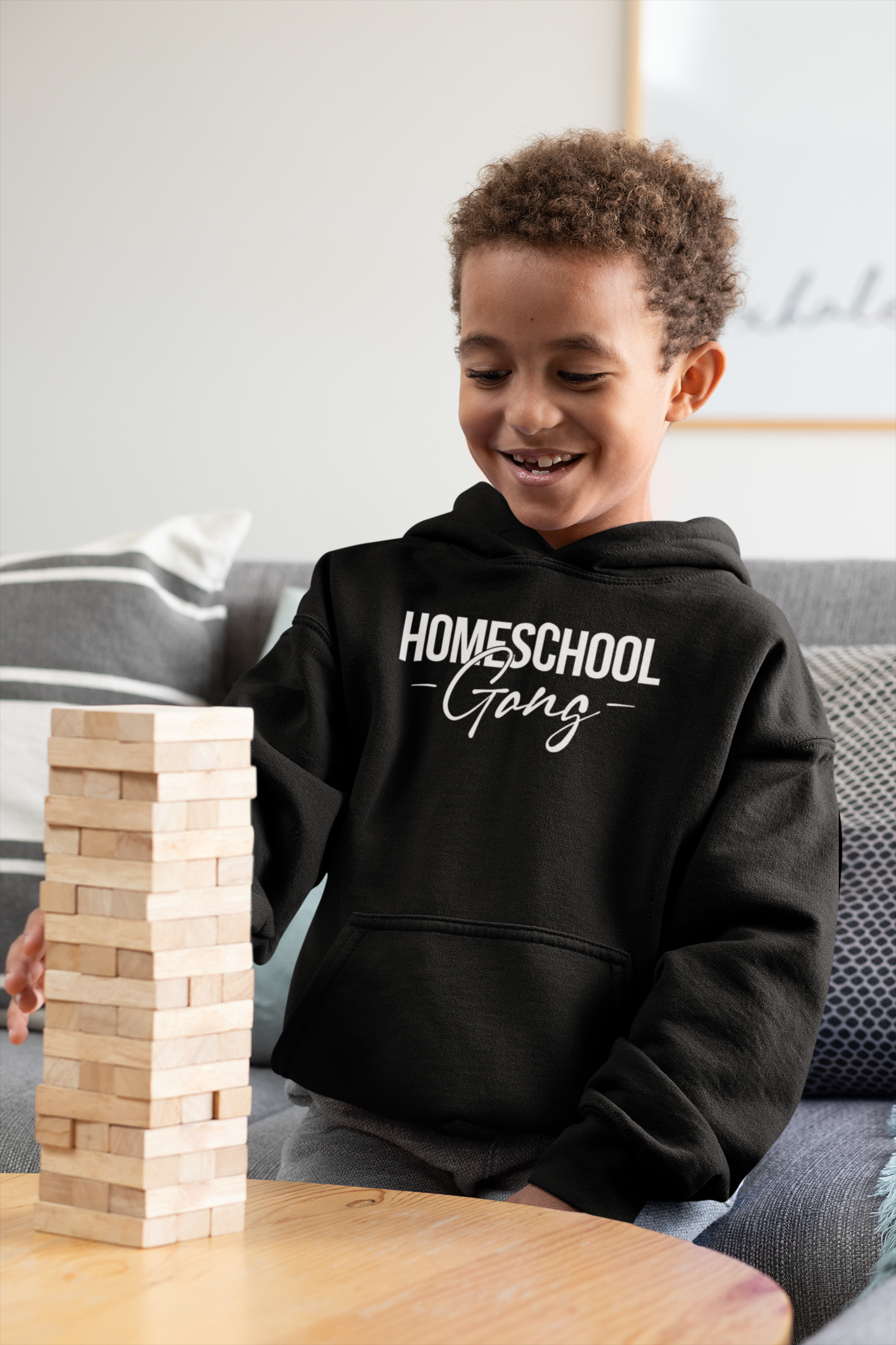 Child wearing the Kids Homeschool Gang Hoodie, displaying its trendy design and comfortable fit.